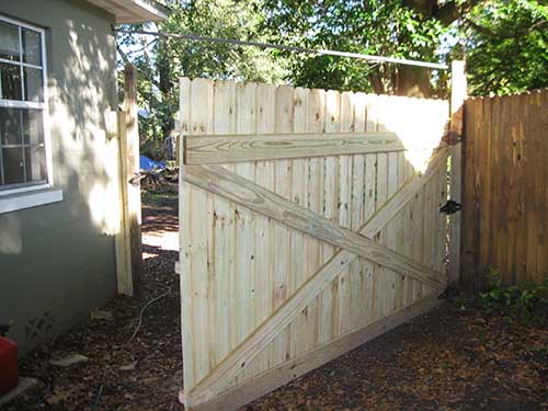 A 10’ gate with support to wall to prevent - sagging. Where there was none.